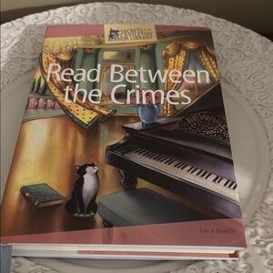Read Between the Crimes Hardcover Book